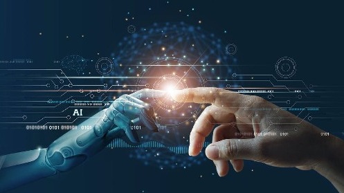 Das Bild zeigt die Hand eines Roboters und eines Menschen, die sich mit dem Zeigefinger berühren.